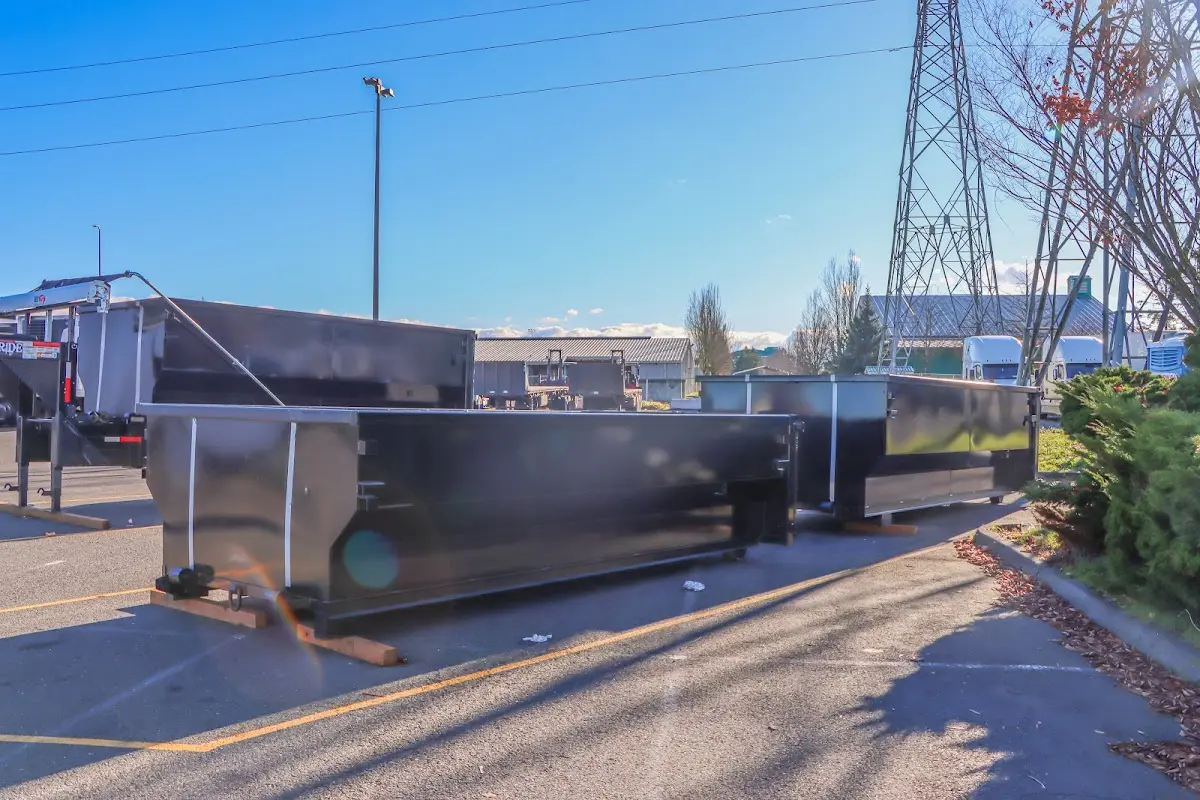 Roll-off dumpster ready for waste disposal at job site for Demolition Dumpster Rental in Federal Way